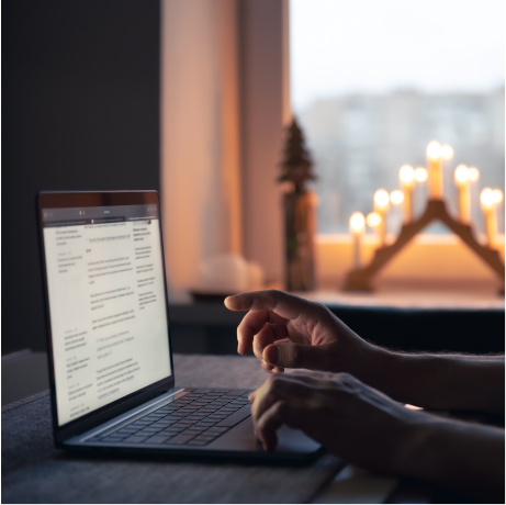 man-reads-news-while-sitting-front-laptop-screen-night-2.png